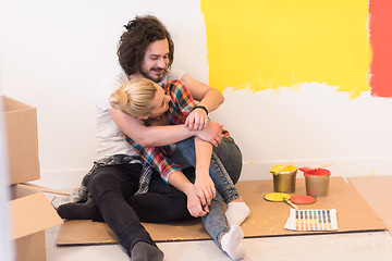 Image showing Happy young couple relaxing after painting