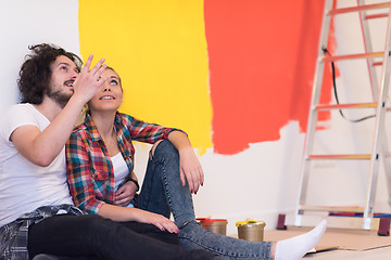 Image showing Happy young couple relaxing after painting