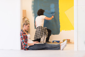 Image showing Happy couple doing home renovations