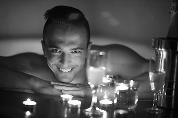 Image showing man relaxing in the jacuzzi