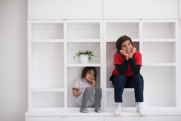 Image showing young boys posing on a shelf