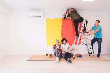 Image showing Happy young couple relaxing after painting