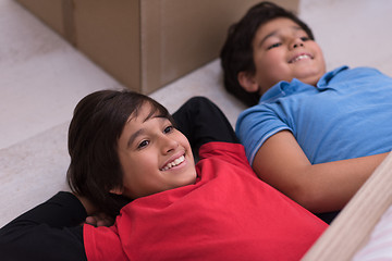 Image showing young boys having fun on the floor