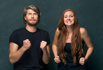 Image showing The young couple with different emotions