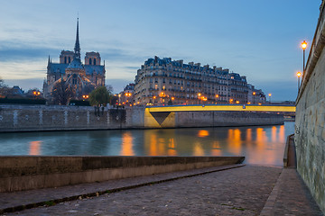 Image showing Notre Dame Cathedral with Paris cityscape at dus