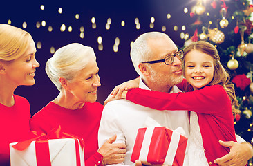 Image showing happy family with christmas gifts