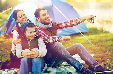 Image showing happy family with tent at camp site