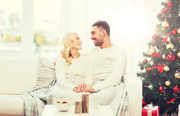 Image showing happy couple at home with christmas tree