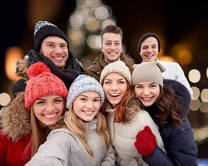 Image showing happy friends taking selfie outdoors at christmas