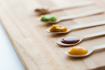 Image showing vegetable or fruit puree or baby food in spoons