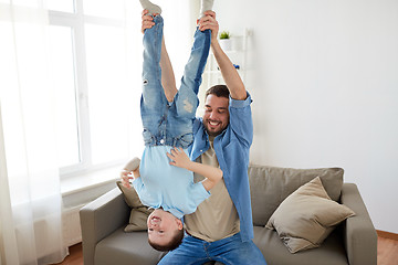 Image showing father with son playing and having fun at home