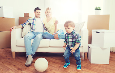 Image showing happy family moving to new home and playing ball