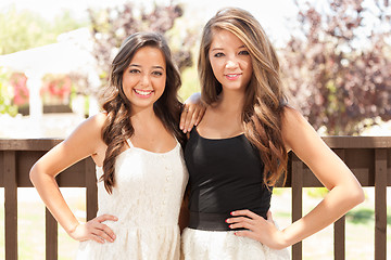 Image showing Two Mixed Race Girlfriends Pose for Portrait Outdoors