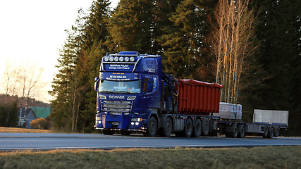 Image showing Customized Blue Scania Trucking at Sunset