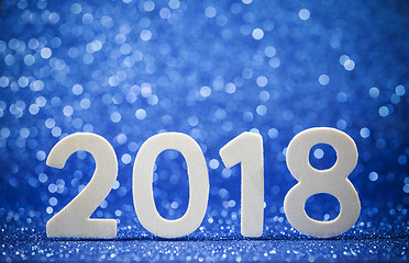 Image showing New year 2018 white wood number on blue paper 