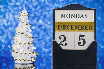 Image showing Christmas ornaments with wooden calendar