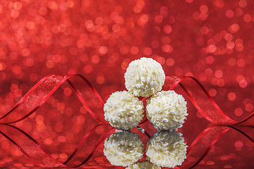 Image showing White snowball Chocolate on glass table