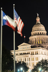 Image showing Flags Fly Night Falls Austin Texas Capital Building Motion