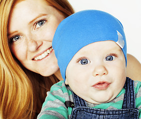 Image showing young beauty mother with cute baby, red head happy modern family