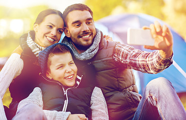 Image showing family with smartphone taking selfie at campsite