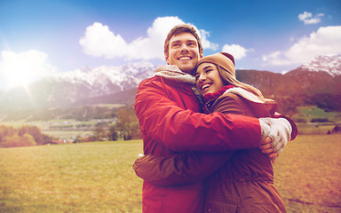 Image showing happy couple hugging over alps mountains