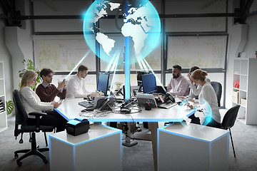 Image showing business team with earth hologram at office