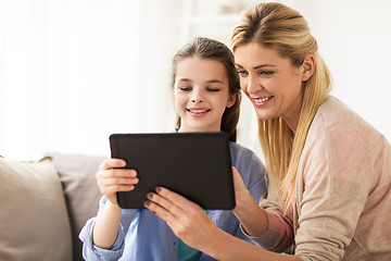 Image showing happy family with tablet pc at home