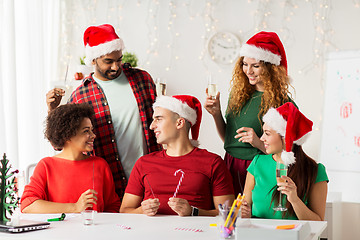 Image showing happy team celebrating christmas at office party