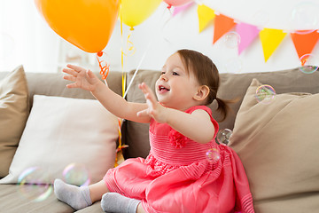 Image showing happy baby girl on birthday party at home