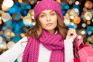 Image showing woman in winter hat with christmas shopping bags