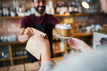 Image showing man or bartender serving customer at coffee shop