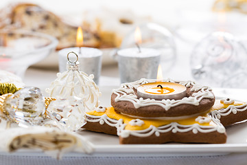 Image showing Decorated Christmas table with gingerbread candle