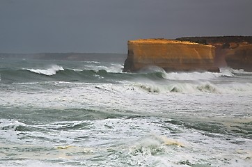 Image showing Rough waves on sandstone shore