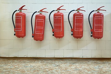 Image showing Fire extinguishers on the wall