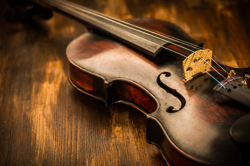 Image showing Violin in vintage style on wood background