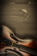Image showing Violin in vintage style on wood background
