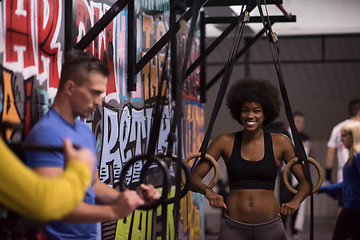 Image showing Portrait of multiethnic couple  after workout at gym