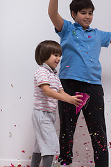 Image showing kids  blowing confetti