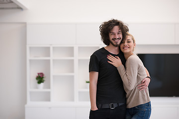 Image showing couple hugging in their new home