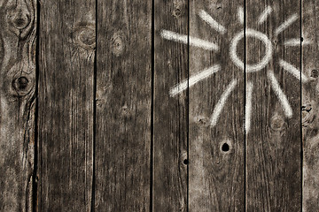 Image showing sun symbol on wooden background