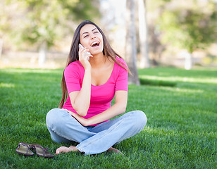 Image showing Beautiful Young Ethnic Woman Talking on Her Smartphone Outside.