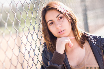 Image showing Beautiful Meloncholy Mixed Race Young Woman Portrait Outside.