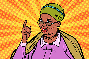 Image showing African elderly woman pointing finger up