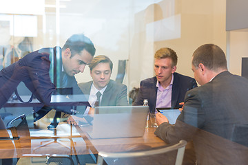 Image showing Business people sitting and brainstorming at corporate meeting.