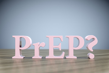 Image showing the letters PrEP? on a wooden table