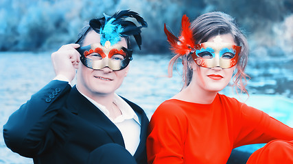 Image showing Couple In Masquerade Masks At A Lake