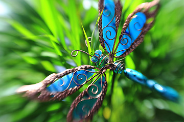 Image showing Artificial butterfly in a plant