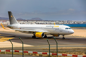 Image showing ARECIFE, SPAIN - APRIL, 15 2017: AirBus A320 of vueling.com with