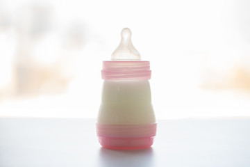 Image showing infant milk formula in baby bottle on table