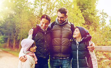 Image showing happy family with backpacks hiking